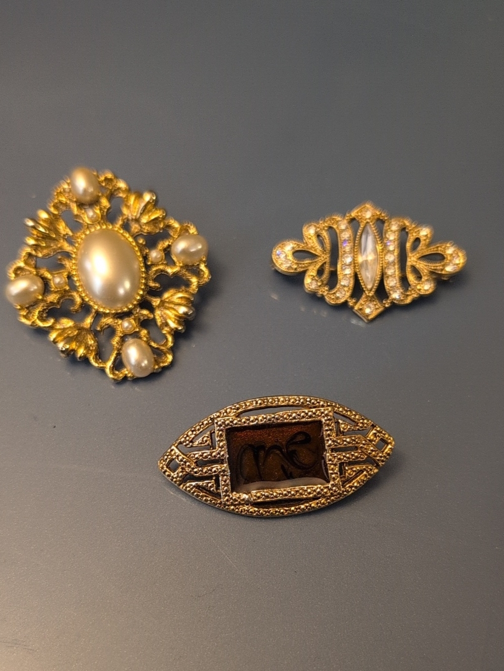 Three Vintage Gold Tone Brooches